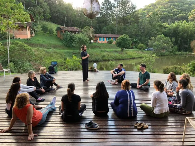 Teaching a circle on a wooden deck by a lake